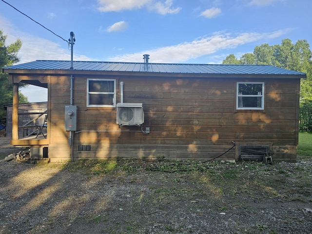 210 Cobb Rd, Lee, ME 04455 - view of side of home featuring an ac unit and a metal roof