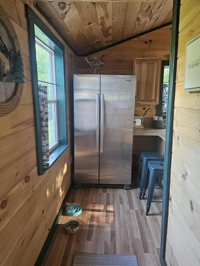 210 Cobb Rd, Lee, ME 04455 - kitchen with freestanding refrigerator, vaulted ceiling, wood walls, wood finished floors, and wood ceiling