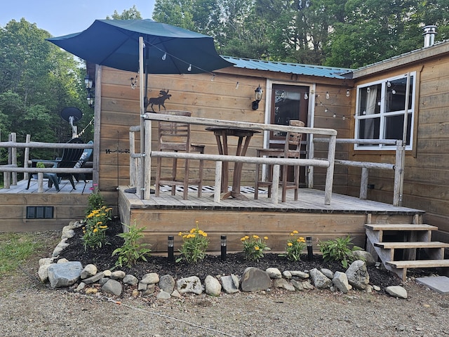 210 Cobb Rd, Lee, ME 04455 - view of front of house featuring a wooden deck and a metal roof