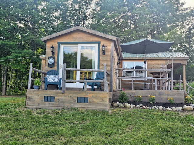 210 Cobb Rd, Lee, ME 04455 - back of house with a yard, a deck, and a metal roof