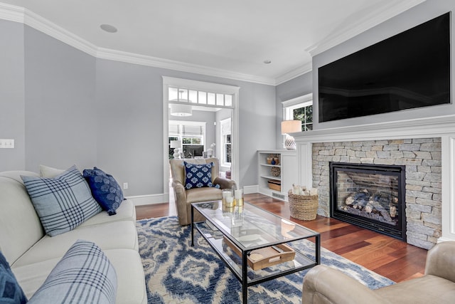 10 Paddock Way, Falmouth, ME 04105 - living room with wood finished floors, ornamental molding, and a stone fireplace