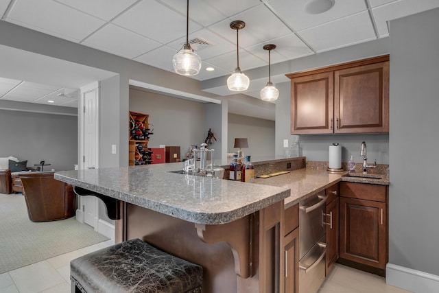10 Paddock Way, Falmouth, ME 04105 - kitchen with a peninsula, a kitchen bar, pendant lighting, a drop ceiling, and light tile patterned flooring