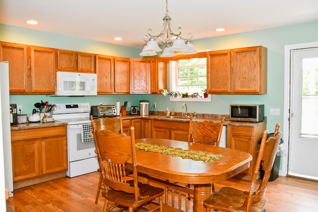 15 Good Heart Ln, Orrington, ME 04474 - kitchen featuring white appliances, plenty of natural light, light wood-style flooring, and recessed lighting