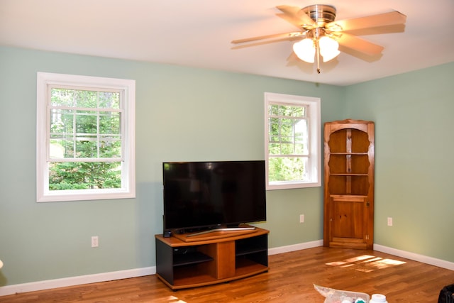 15 Good Heart Ln, Orrington, ME 04474 - living area with wood finished floors and a ceiling fan