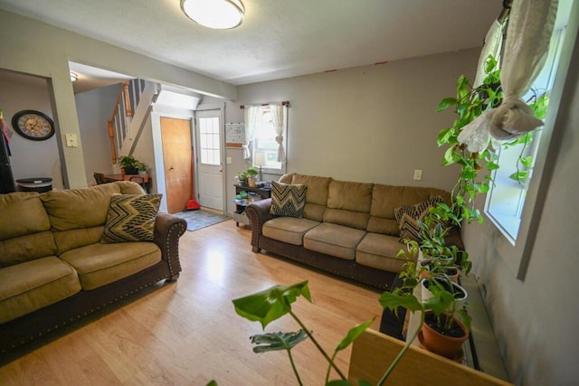 488 Bog Rd, Hermon, ME 04401 - living room featuring wood finished floors and stairs