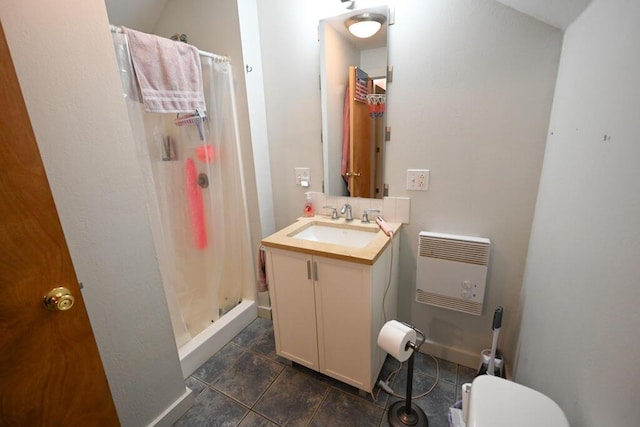 488 Bog Rd, Hermon, ME 04401 - bathroom with heating unit, vanity, a shower stall, and tile patterned flooring