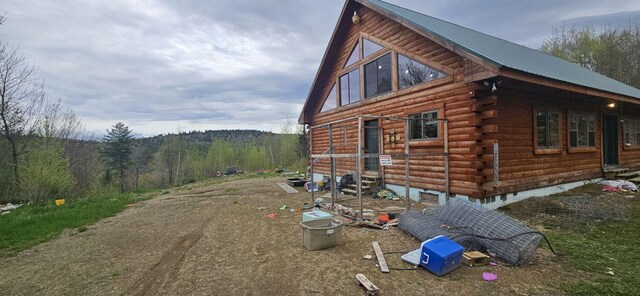149 Temple Rd, Wilton, ME 04294 - view of home's exterior with log siding