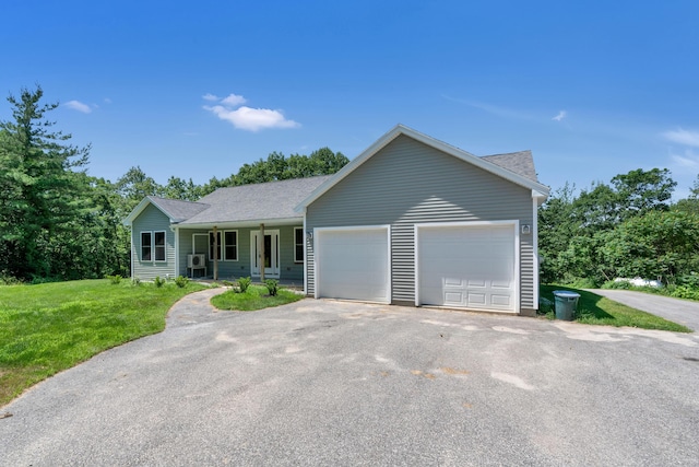 21 Cummings Way, Falmouth, ME 04105 - single story home with a front yard, an attached garage, roof with shingles, covered porch, and driveway