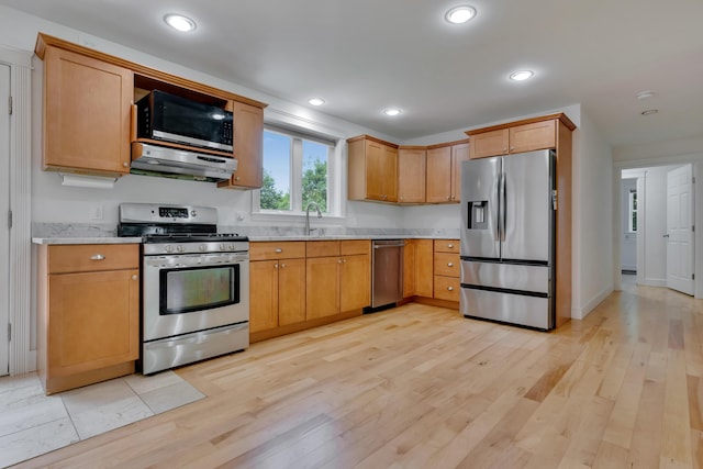 21 Cummings Way, Falmouth, ME 04105 - kitchen with appliances with stainless steel finishes, under cabinet range hood, light wood finished floors, recessed lighting, and light stone countertops