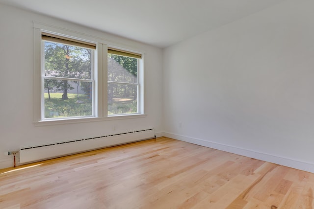 21 Cummings Way, Falmouth, ME 04105 - unfurnished room featuring baseboard heating and wood finished floors