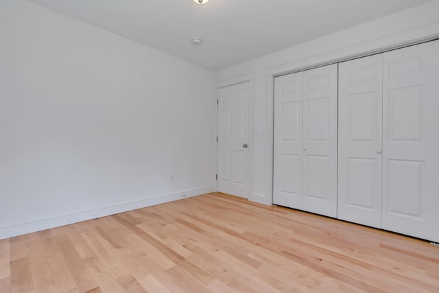 21 Cummings Way, Falmouth, ME 04105 - unfurnished bedroom featuring light wood-style flooring and a closet