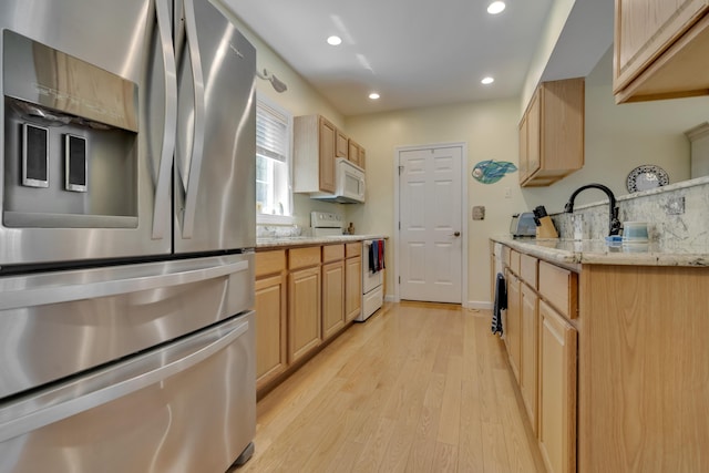 23 Chestnut Ln Unit 23, Wells, ME 04090 - kitchen with white appliances, light brown cabinetry, and recessed lighting