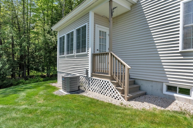 23 Chestnut Ln Unit 23, Wells, ME 04090 - view of side of home featuring a lawn and a central AC unit