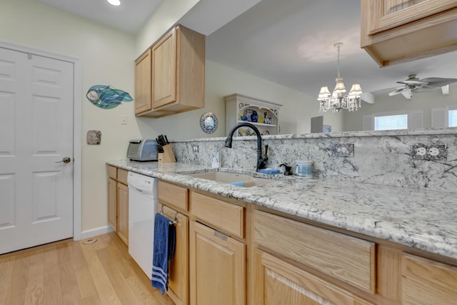 23 Chestnut Ln Unit 23, Wells, ME 04090 - kitchen featuring light brown cabinets, dishwasher, light wood-type flooring, a chandelier, and light stone counters