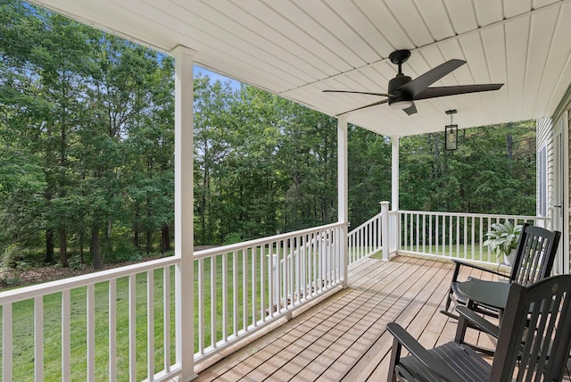 7 Dakota Ln, Dresden, ME 04342 - wooden deck featuring ceiling fan, a yard, and view of wooded area