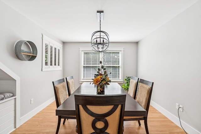 7 Dakota Ln, Dresden, ME 04342 - dining room with a chandelier and light wood-style flooring