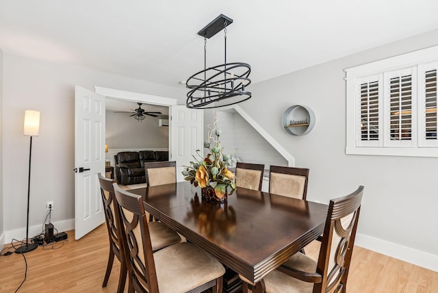 7 Dakota Ln, Dresden, ME 04342 - dining room with a ceiling fan, light wood-style flooring, and a chandelier