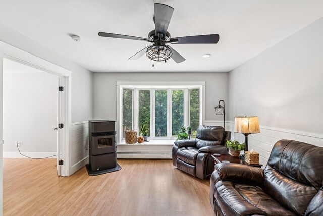 7 Dakota Ln, Dresden, ME 04342 - living room featuring baseboard heating, a wainscoted wall, light wood finished floors, a ceiling fan, and recessed lighting