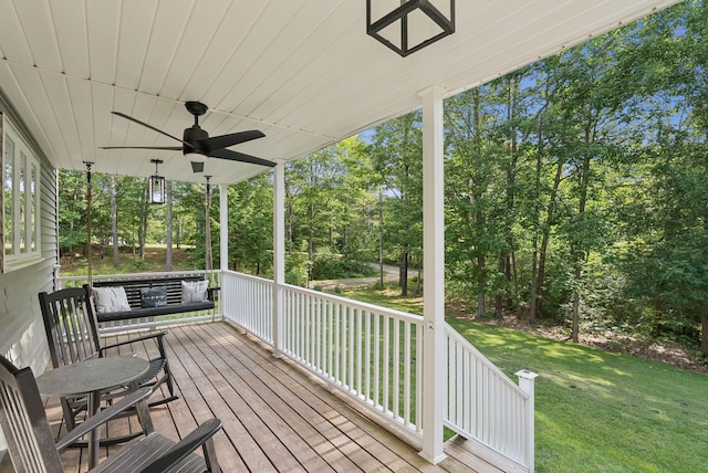 7 Dakota Ln, Dresden, ME 04342 - porch with ceiling fan, a lawn, and view of scattered trees