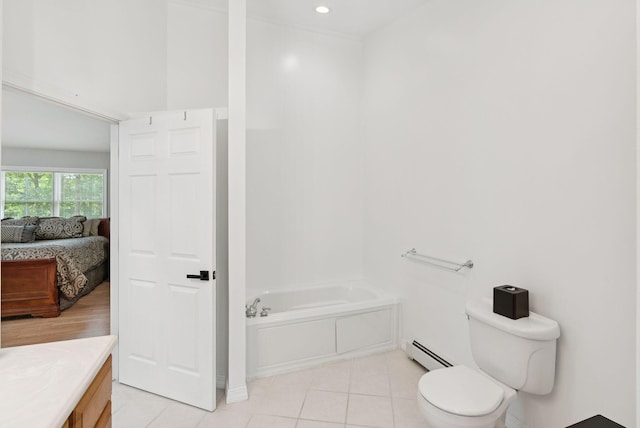 7 Dakota Ln, Dresden, ME 04342 - bathroom with a baseboard radiator, a bath, vanity, connected bathroom, and tile patterned floors