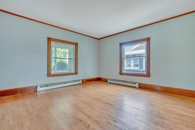 15 Snow Park, Bath, ME 04530 - spare room with a baseboard radiator, wood finished floors, and ornamental molding