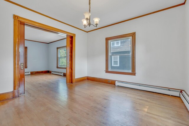 15 Snow Park, Bath, ME 04530 - unfurnished room featuring crown molding, a chandelier, wood finished floors, and a baseboard heating unit