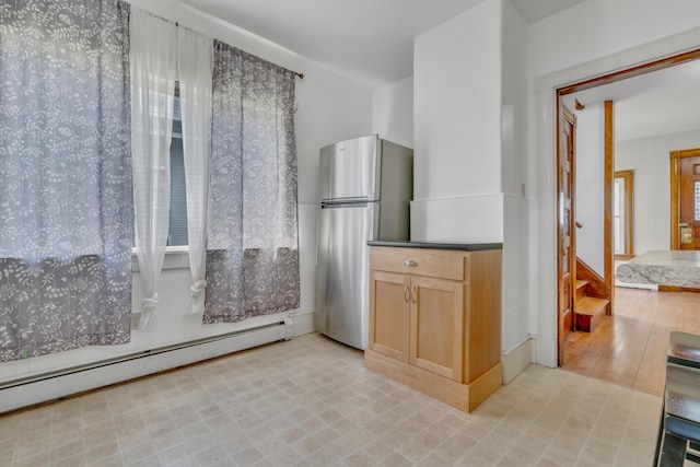 15 Snow Park, Bath, ME 04530 - kitchen with freestanding refrigerator, a baseboard heating unit, plenty of natural light, and light brown cabinetry