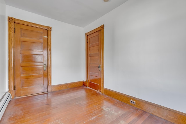 15 Snow Park, Bath, ME 04530 - unfurnished room featuring a baseboard heating unit and light wood-type flooring