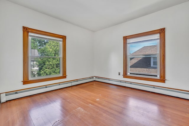 15 Snow Park, Bath, ME 04530 - empty room featuring wood finished floors and a baseboard heating unit