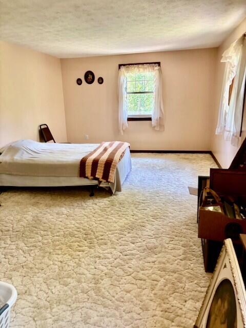 2 Oak Ridge Rd, Kennebunkport, ME 04046 - carpeted bedroom featuring a textured ceiling