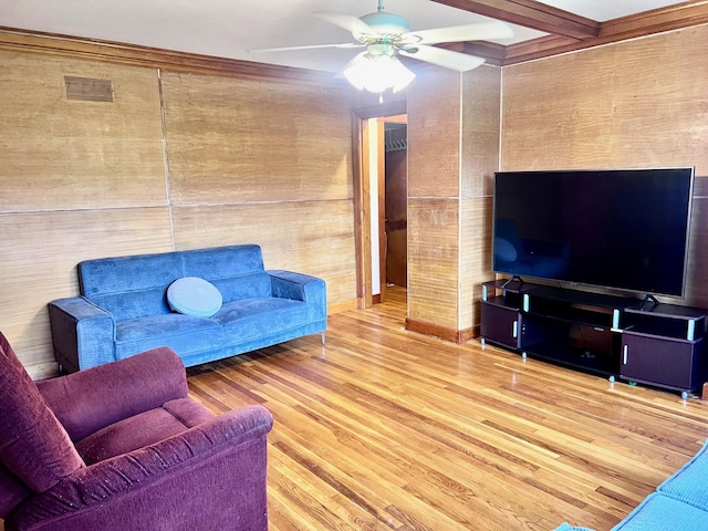 17 Pleasant St, Wilton, ME 04294 - living room featuring wood finished floors, ceiling fan, and beamed ceiling