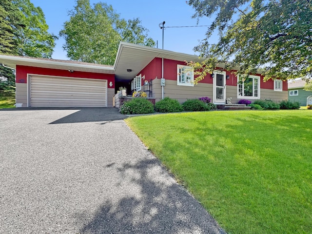 749 Main St, Madawaska, ME 04756 - view of front of home featuring driveway, a front yard, and an attached garage