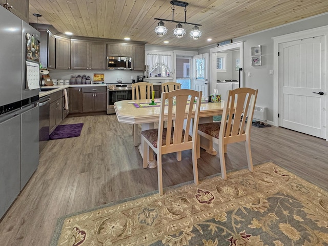 749 Main St, Madawaska, ME 04756 - dining area with light wood-style flooring, wooden ceiling, washing machine and dryer, and recessed lighting