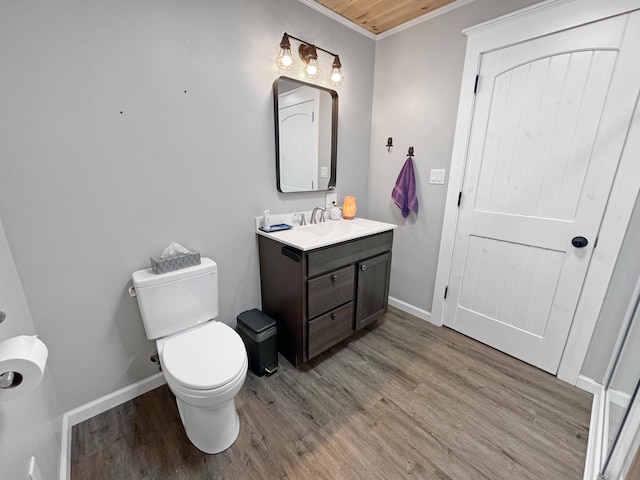 749 Main St, Madawaska, ME 04756 - half bathroom with vanity, wood finished floors, and crown molding