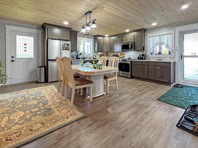 749 Main St, Madawaska, ME 04756 - kitchen with stainless steel appliances, recessed lighting, wooden ceiling, decorative light fixtures, and dark brown cabinets