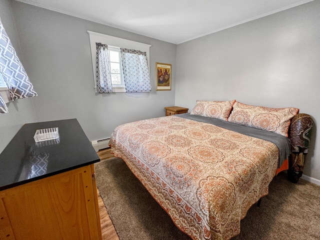 749 Main St, Madawaska, ME 04756 - bedroom featuring a baseboard radiator, ornamental molding, and light wood-type flooring