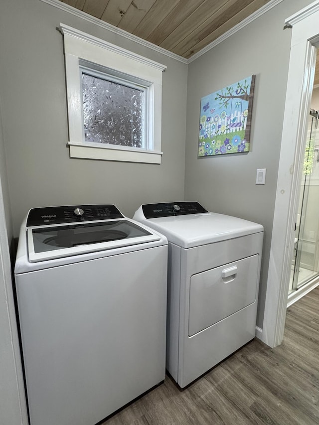 749 Main St, Madawaska, ME 04756 - washroom featuring separate washer and dryer, wood finished floors, and crown molding