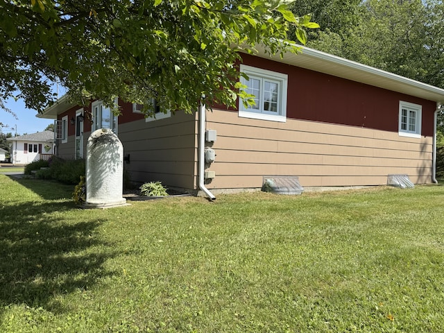 749 Main St, Madawaska, ME 04756 - view of side of property with a yard