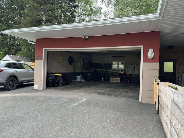 749 Main St, Madawaska, ME 04756 - garage featuring asphalt driveway