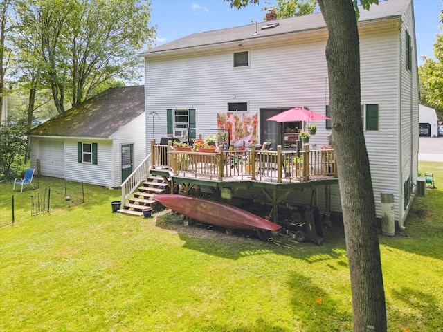 100 Starlight Dr, Brewer, ME 04412 - back of property with a deck and a detached garage