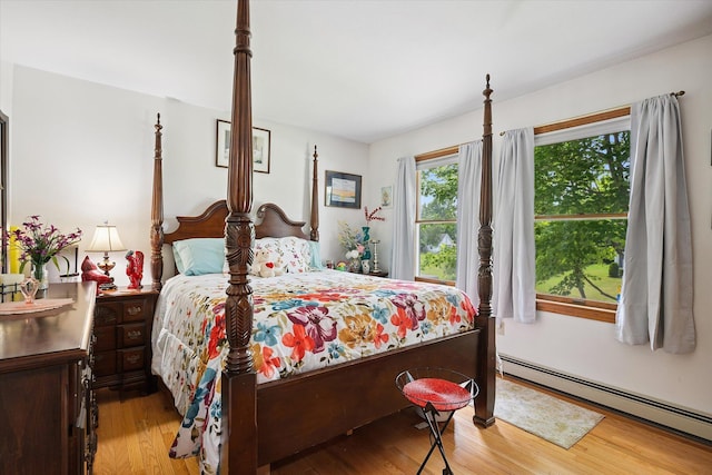 100 Starlight Dr, Brewer, ME 04412 - bedroom with a baseboard heating unit and wood finished floors