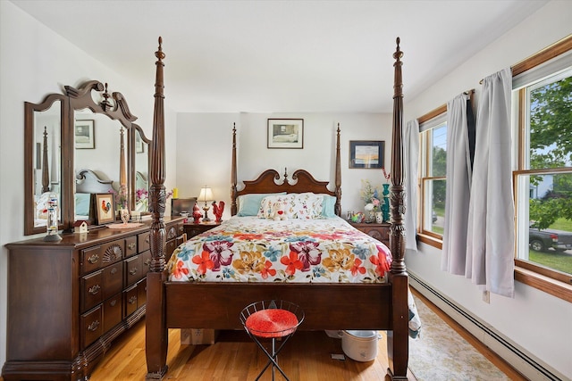 100 Starlight Dr, Brewer, ME 04412 - bedroom featuring a baseboard radiator and light wood-style floors
