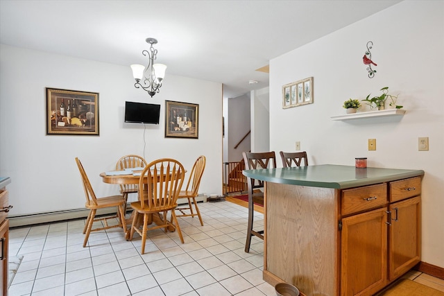 100 Starlight Dr, Brewer, ME 04412 - dining area featuring a chandelier, light tile patterned flooring, and baseboard heating