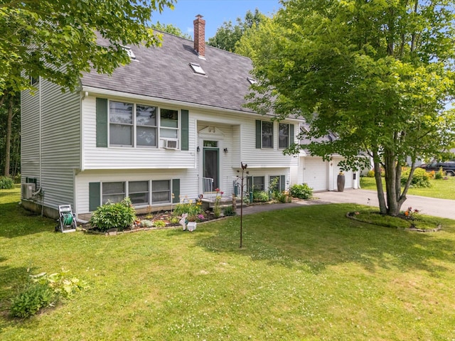 100 Starlight Dr, Brewer, ME 04412 - raised ranch with concrete driveway, a front yard, a garage, a chimney, and roof with shingles