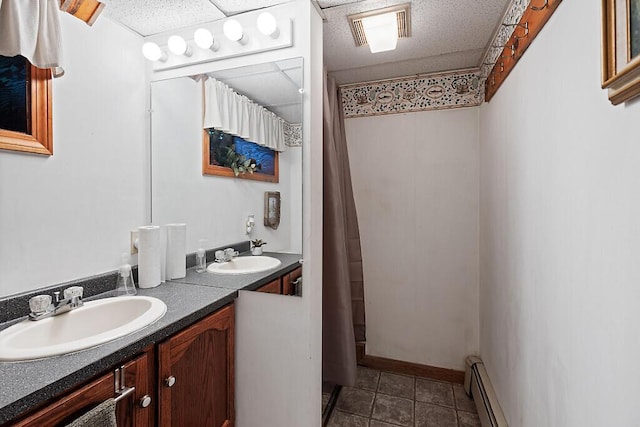 1 Castle View Ln, Belgrade, ME 04917 - bathroom with a baseboard heating unit, double vanity, tile patterned flooring, and a shower with curtain