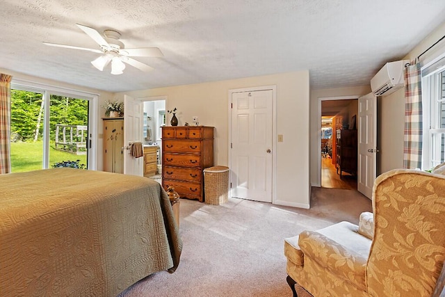 1 Castle View Ln, Belgrade, ME 04917 - bedroom featuring an AC wall unit, access to exterior, light carpet, a ceiling fan, and connected bathroom