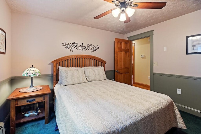 1 Castle View Ln, Belgrade, ME 04917 - carpeted bedroom featuring a ceiling fan and a textured ceiling