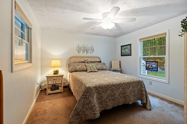 1 Castle View Ln, Belgrade, ME 04917 - bedroom featuring carpet, a baseboard radiator, a textured ceiling, and ceiling fan