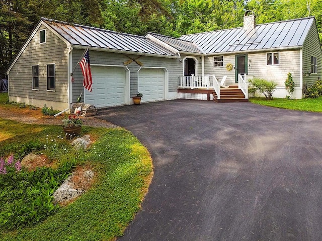 1 Castle View Ln, Belgrade, ME 04917 - ranch-style house with a standing seam roof, a chimney, and a metal roof