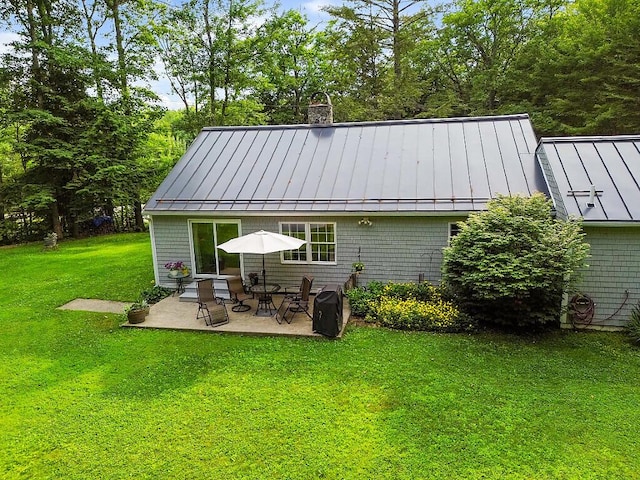 1 Castle View Ln, Belgrade, ME 04917 - back of property with a standing seam roof, a metal roof, and a patio area